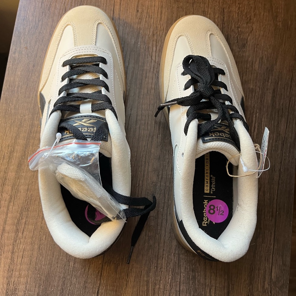 Reebok women’s Black and Cream Sneakers